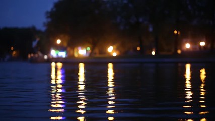 Wall Mural - evening water and reflection of lights in the lake