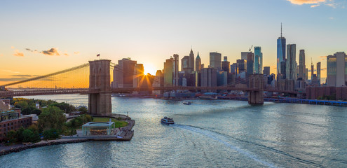 Wall Mural - New York City skyline buildings Brooklyn Bridge evening sunset