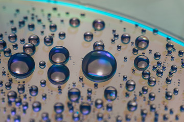 Aufkleber - Close up colored water drops on a cd dvd disk background.