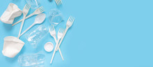 Set Of Plastic Utensils Glasses, Forks, Spoons On A Blue Background, Flat Lay. Concept Collection Of Recycling Plastic Waste Recycling. Ecology Environmental Care.Banner