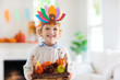 © famveldman - Child on Thanksgiving. Kid with autumn turkey hat.