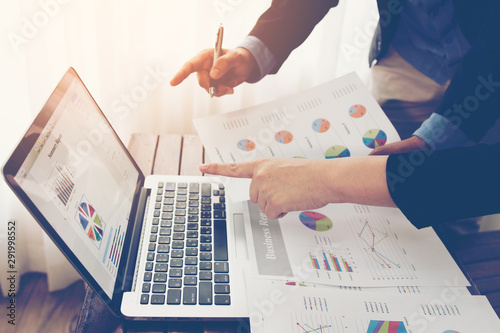 Fotomural Team of business investment consultant analyzing company annual financial report balance sheet statement working with documents graphs