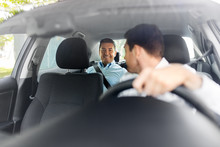 Transportation, Vehicle And People Concept - Middle Aged Male Passenger Talking To Car Driver