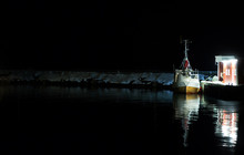Fishing Boat Waiting At Night To Leave The Docks