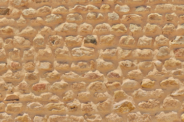 Texture of retro sandstone brickwork. Texture antique masonry brick of limestone. Stone wall at the excavations of historical monuments.