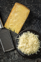 Wall Mural - Tasty grated cheese. Parmesan cheese.