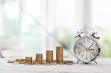 Coins and alarm clock.