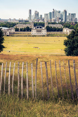 Wall Mural - London panorama seen from Greenwich park viewpoint. Symbolic provisional fence in the foreground