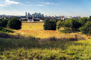 Wall Mural - London panorama seen from Greenwich park viewpoint. Symbolic Broken fence in the foreground