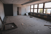 Dirty Empty Rooms, With Broken Windows And Furniture, In An Abandoned Building.