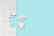 © nattawatstocker - Jigsaw puzzle white piece on blue backdrop