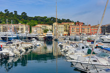 The Old Port At Nice, France With Expensive Boats Moored Up