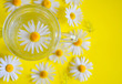 cup of tea with chamomile on a yellow background. aromatic hot drink. healthy lifestyle. herbal tea.
