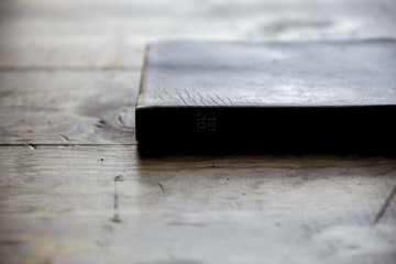 Wall Mural - Close shot of a holy bible on a wooden surface