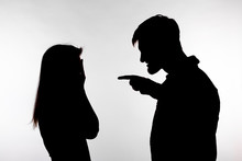 Aggression And Abuse Concept - Man And Woman Expressing Domestic Violence In Studio Silhouette Isolated On White Background.