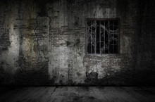 Window And Rusty Bars Covered With Cob Web Or Spider Web On Prison Old Bricks Wall And Dusty Floor, Concept Of Horror And Halloween