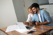 © NDABCREATIVITY - Photo of cheerful loving young couple using laptop