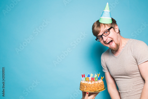 Crazy Funny Young Man In Glasses And Paper Congratulatory Hats