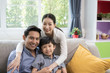 © FrameAngel - Asian family father, mother and son smiling together in living room, happy family concept