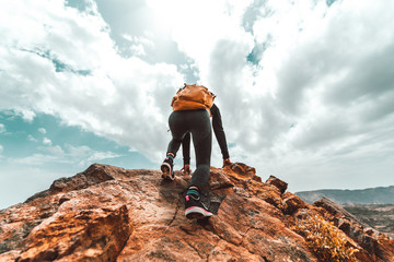 Wall Mural - Successful hiker hiking on mountain peak.