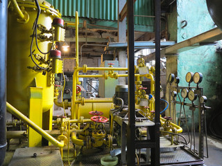 Industrial big water pumps with electric motors, pipes, tubes, equipment and steam turbine at power plant