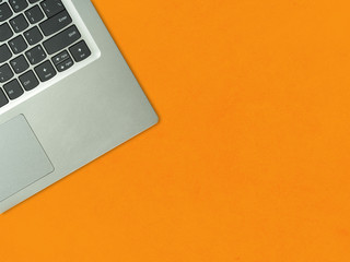 computer on orange background