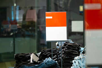 Wall Mural - signs with mockup in a clothing store. light industry in clothing stores. sign with white and red background