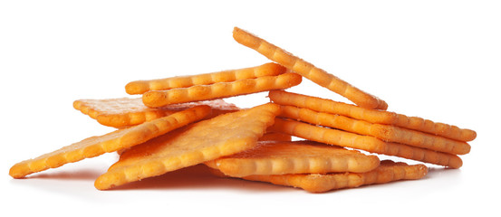 Pile of salted crackers isolated on white background