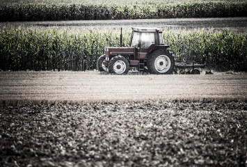 nice view of a farmer plowing his fields