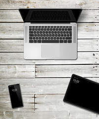 Wall Mural - Laptop, tablet and phone set mockup on a wooden background. 3D render