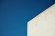 © Cavan Images - Part of building against blue sky
