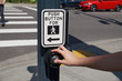 A pedestrian light switch with voice guidance and comprehensive operating instructions. Pedestrian presses the button.