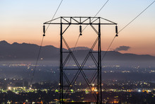 Predawn View Of Electric Power Lines Entering The San Fernando Valley And Los Angeles, California.  The San Gabriel Mountains Are In Background.  