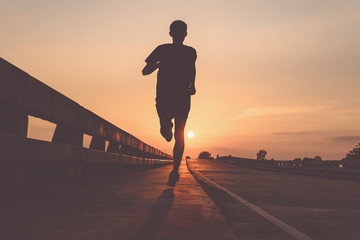 athlete runner feet running on road, jogging at outdoors. man running for exercise.sports and health