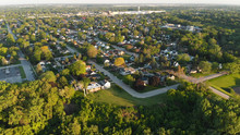 Aerial View Of Residential Houses At Summer. American Neighborhood, Suburb.  Real Estate, Drone Shots, Sunset, Sunlight, From Above.