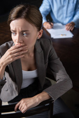 Wall Mural - sad pensive woman looking away and man signing documents at table