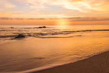 sunset sky with colorful cloud and dramatic sunlight on twilight over sea,amazing majestic nature sky background,idyllic beautiful cloudy with sunrise