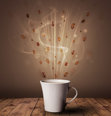 Wall Mural - Steaming cup of coffee and coffee beans