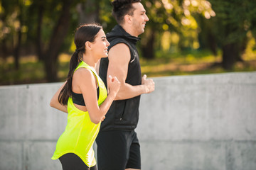 Sticker - Sporty young couple running outdoors