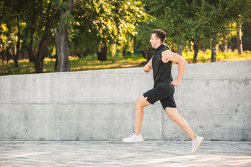 Sticker - Sporty young man running outdoors