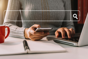 Searching Browsing Internet Data Information with blank search bar.businessman working with smart phone, tablet and laptop computer on desk in office. Networking Concept 