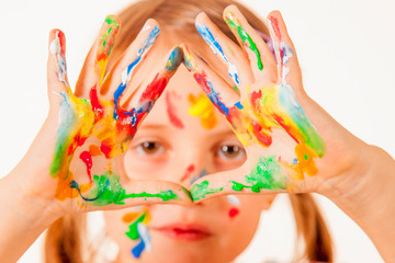 Little girl hands painted in colorful paints. People, childhood, art concept.