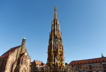 Our Lady's church (Frauenkirche) and Schöner Brunnen fountain (beautiful fountain) at the Nürnberg Hauptmarkt (central square) in Nuremberg, Bavaria, Germany.