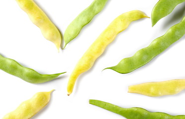 Green and yellow string beans isolated on white background, top view