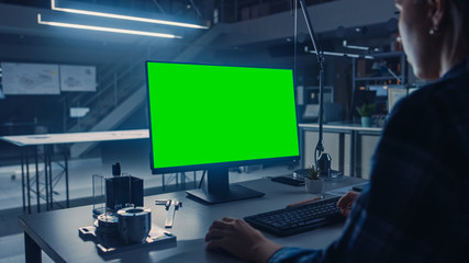 Leinwandbilder - Over the Shoulder Shot of Engineer Working with Green Mock-up Screen Desktop Computer. Industrial Design Engineering Facility.