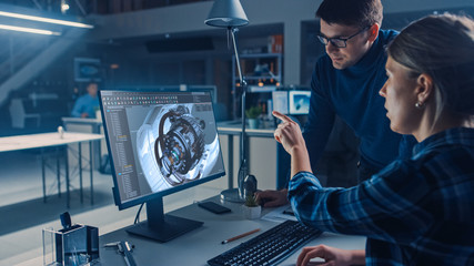 Poster - Engineer Working on Desktop Computer, Screen Showing CAD Software with Engine 3D Model, Her Male Project Manager Explains Job Specifics. Industrial Design Engineering Facility Office