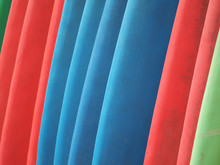 Colorful Surfboards Stand In A Row For Hire.