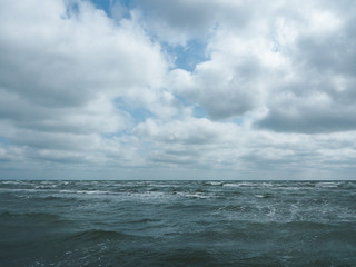  Stormy sea and sky with clouds above it