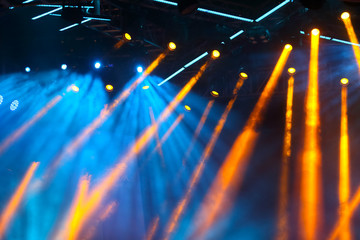 concert lights crowd in front of bright stage vivid color with copy space