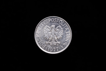 Polish People's Republic, Polska Rzeczpospolita Ludowa old 50 groszy coin from 1977, obverse showing the coat of arms. Isolated on black background